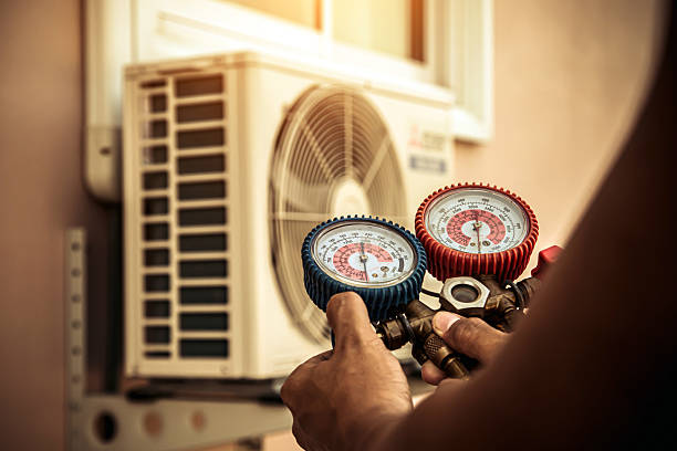 Professional Air Conditioning Service technician working in Huntersville, NC
